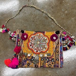 Bohemian Beaded tassles bag with intricate patterns and textures